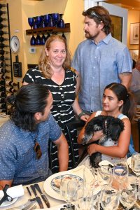 The event was attended by friends of both Anne and Power Paws, including board member Danielle Spahle (center) and her husband Nick (top right)